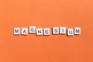 magnesium scrabble letters word on a orange backgr 2023 11 27 05 29 15 utc