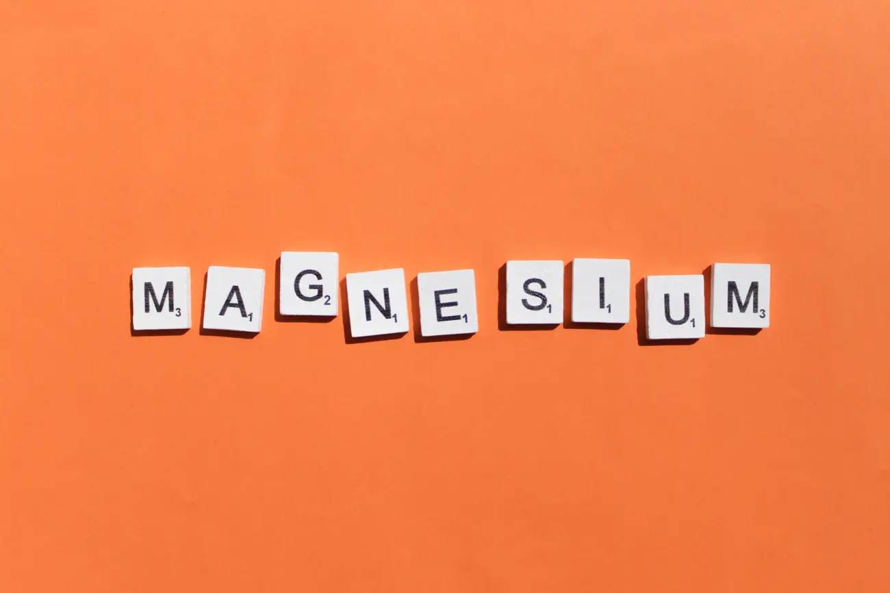 magnesium scrabble letters word on a orange backgr 2023 11 27 05 29 15 utc